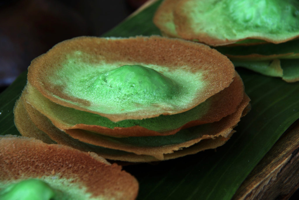 Kue ape pancakes from Indonesia are bright green, showing the variety of easy pancakes from around the world. (Image by MielPhotos2008 and iStock)