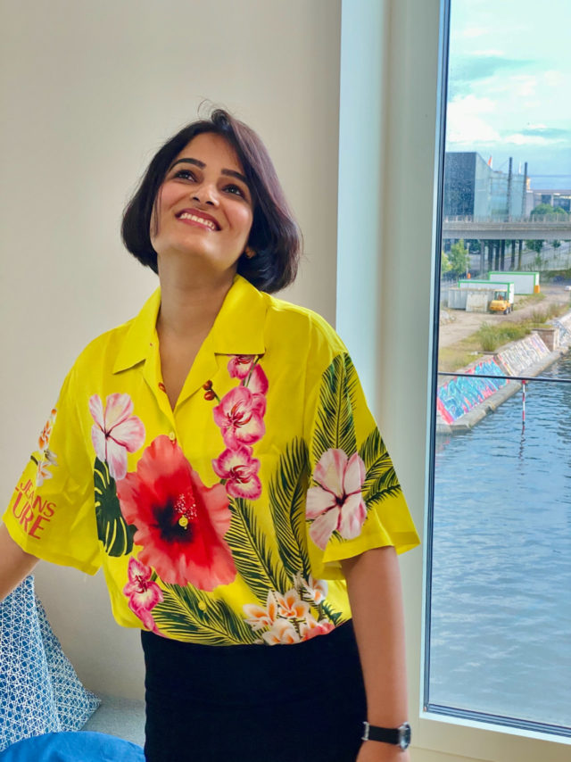 Nistha sporting a vivid turmeric-colored shirt shows how cooking with spices based on Indian tradition also feeds her creativity. (Image © by Nistha Trehun, The Kitty Party)