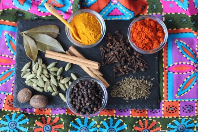 An array of spices shows why the Indian tradition of cooking with spices helps create a variety of tastes, flavors, and colors. (Image by Veganamente and Pixabay)