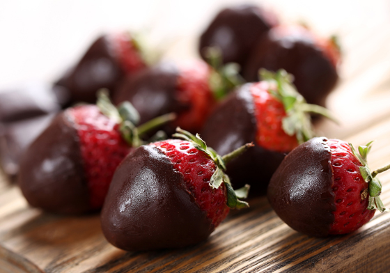 Chocolate covered strawberries, showing the cultural traditions of Chocolate-Covered Anything Day. (Image © iStock/5second.)