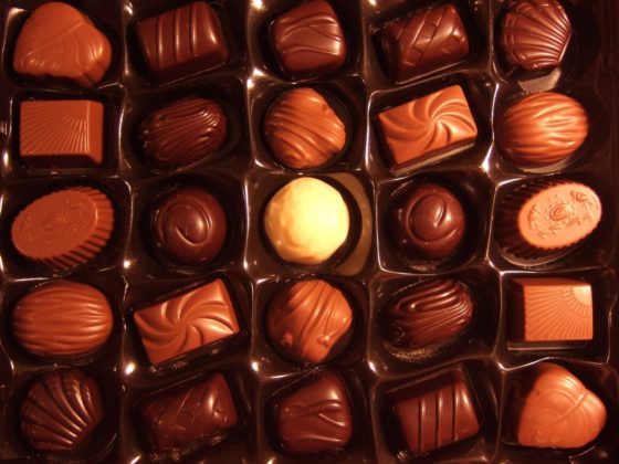 A box of chocolates, showing the cultural traditions of National Chocolate-Covered Anything Day. (Image from PxHere.)