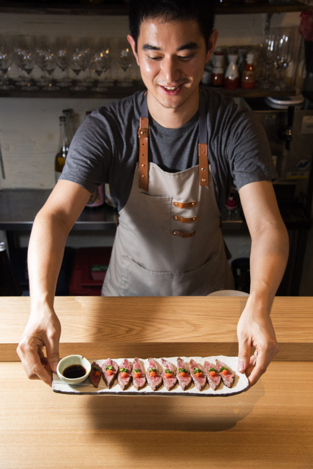Yuma Wada serves sushi in Tokyo, the setting for his Japanese food tour and trivia night. (Image © by Yuma Wada/ Ninja Food Tours)
