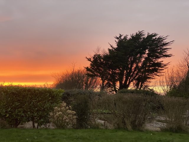 A sunset in County Cork evokes memories celebrated with cultural authenticity on St Patrick’s Day in Ireland. (Image © Joyce McGreevy)