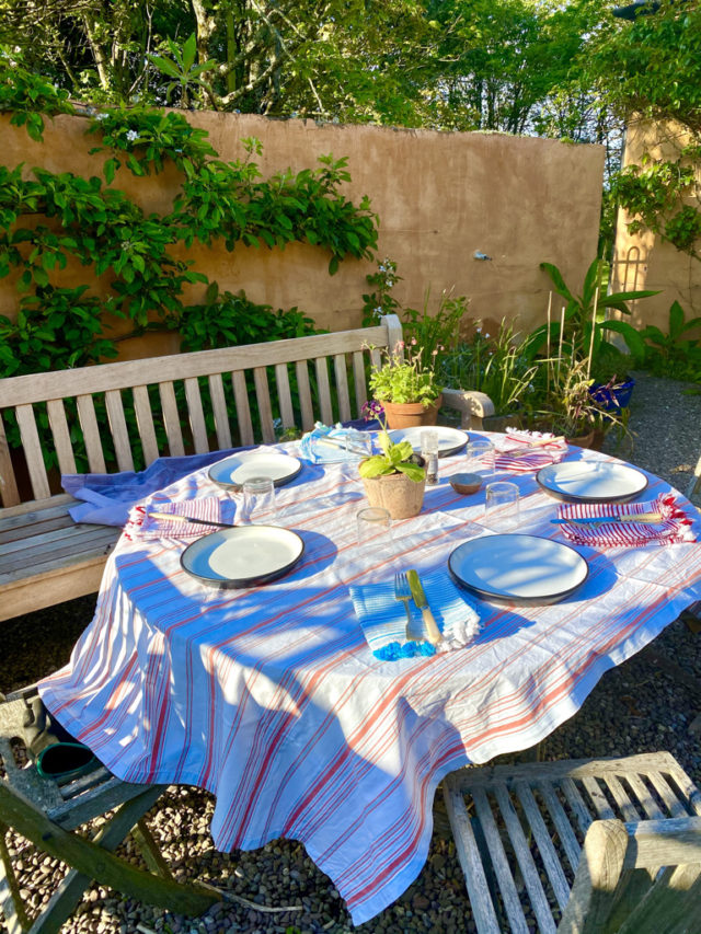 An outdoor table set for dinner in County Cork evokes memories celebrated with cultural authenticity on St Patrick’s Day in Ireland. (Image © Joyce McGreevy)