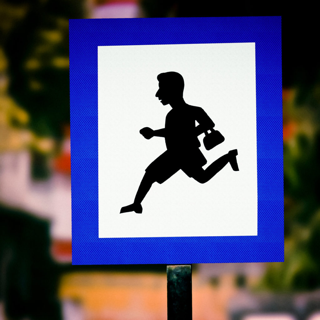 This square blue-bordered school zone sign from India shows a boy running to school and is part of a series of school zone signs from different cultures. Image © yogesh_more/iStock.