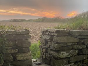 A wall with a small opening reminds the author that cross-cultural tips for care can help you stay calm, even when the world is in crisis. (Image © Joyce McGreevy)