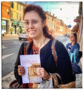 A young author in Italy showing off her first published book illustrates why an important travel planning tip for Italy is to learn some Italian before you travel. (Image © by Joyce McGreevy)