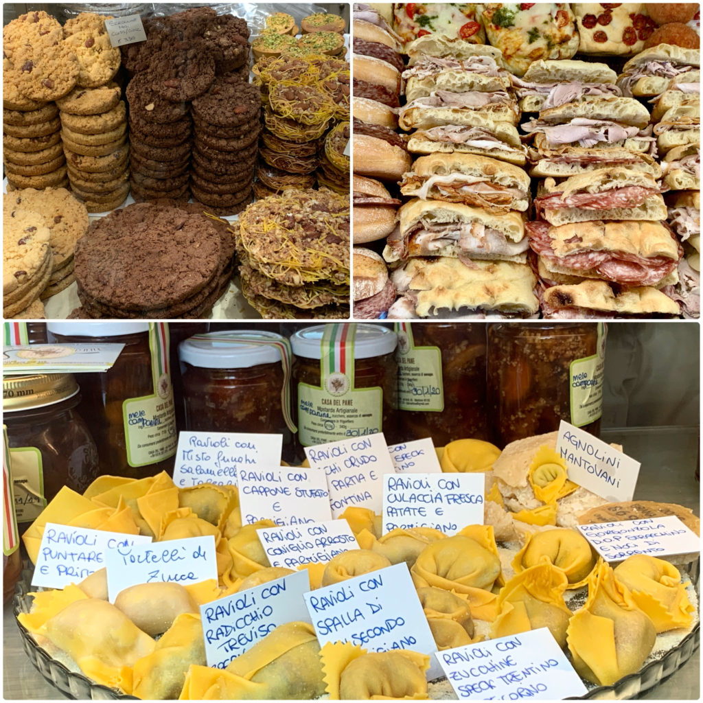 Several varieties of cookies, pasta, and sandwiches in Mantova, illustrating why learning about the regional food is part of the author's travel planning tips for Italy. (Image © by Joyce McGreevy)